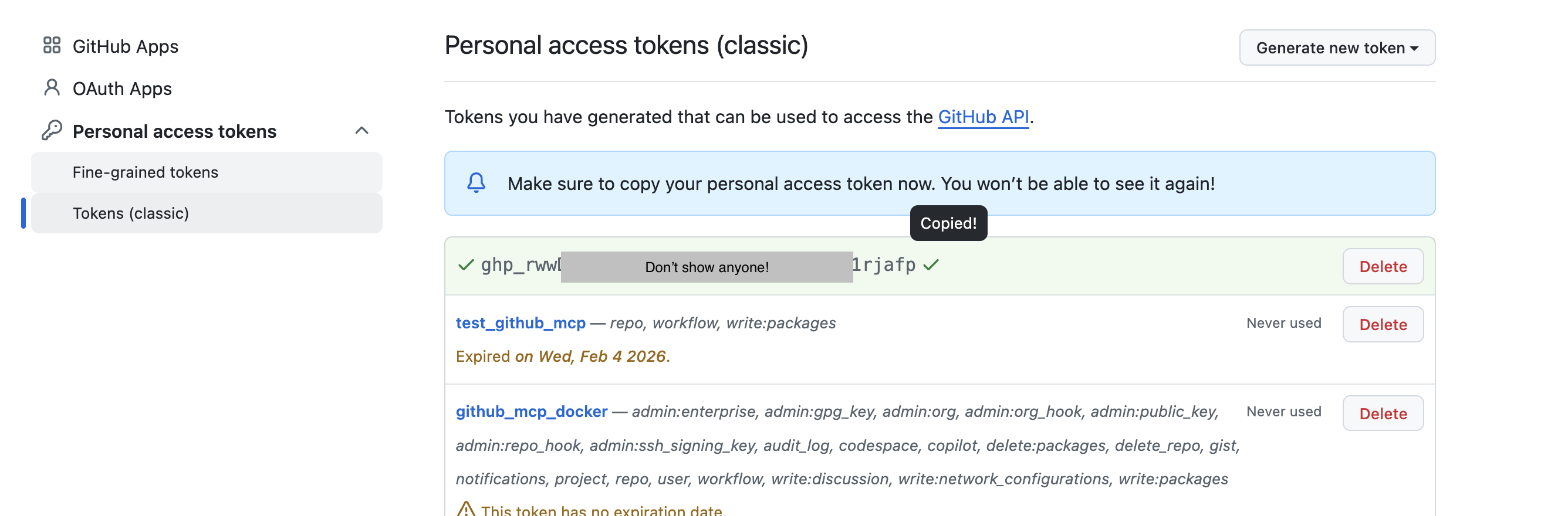 The new token shown once on GitHub, blurred here, with the message Make sure to copy your personal access token now.